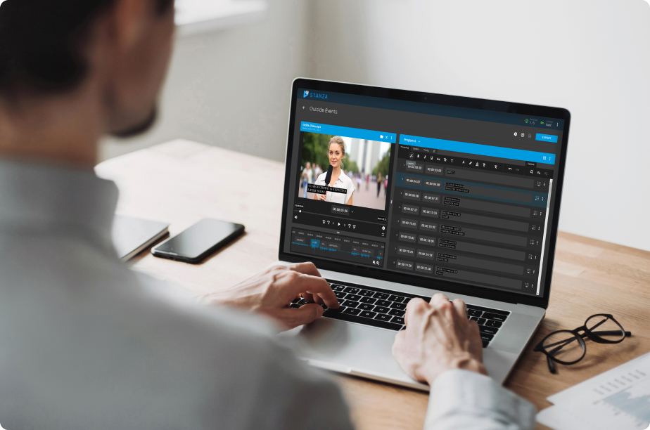 laptop computer with man operating showing shortcuts for video software