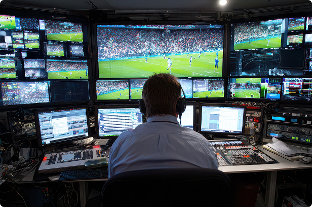 man monitoring sports events in studio