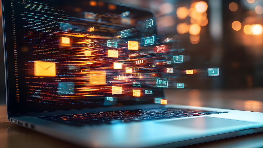 Laptop displaying colorful streams of digital data and icons, including envelopes and interface elements, symbolizing fast data transfer and parallel processing in a modern technology environment.