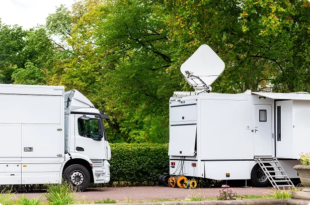mobile video broadcast production trucks white with satellites