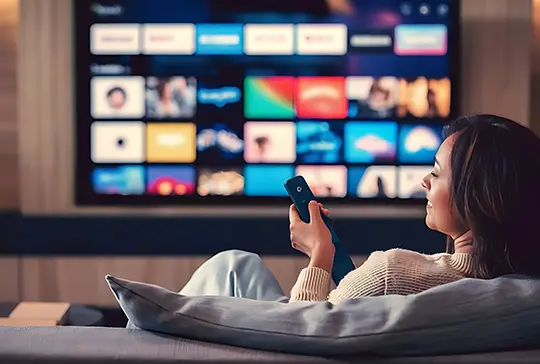 streamline platforms scaling for efficiency lady on couch watching stremaing on tv